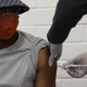 A woman at the Baragwanath hospital in Soweto, South Africa receiving an injection as a part of a covid-19 vaccine trial in June 2020.